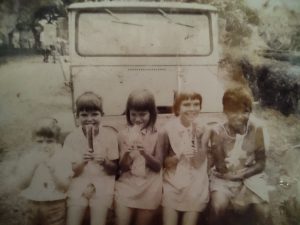 Misima Island, PNG brothers & sisters enjoying an icy pole on the Jungle Rover